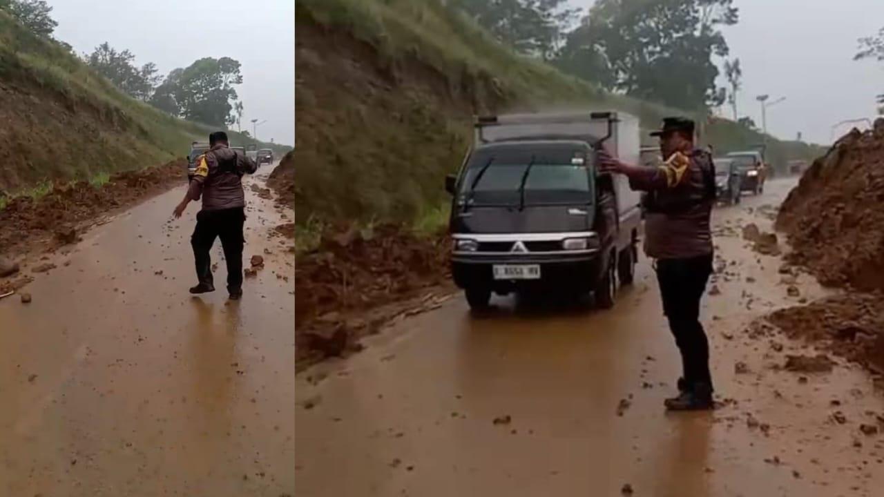 Heroik! Aksi Bhabinkamtibmas di Tengah Hujan Deras Bersihkan Material Longsor Jalan Cisinga Sambil Atur Lalin